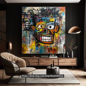 Op de afbeelding: Een kleurrijk abstract schilderij van een gezicht met een brede glimlach. Het schilderij is gemaakt in graffiti-stijl met felle kleuren en zwarte contouren. De achtergrond is een mix van zwart, wit en grijs.