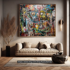 May include: Abstract art painting with a colorful, graffiti-style design featuring a large, stylized face with bold lines and geometric shapes. The painting is framed and displayed on a wall in a modern living room setting.