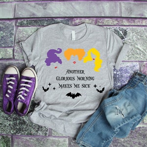 May include: Gray t-shirt with a graphic of three witches from the movie Hocus Pocus. The text reads "Another Glorious Morning Makes Me Sick".