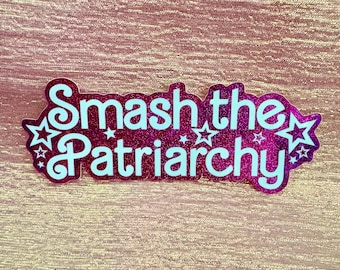 May include: Pink glitter sticker with the text "Smash the Patriarchy" in white lettering. The sticker has five white stars around the text.