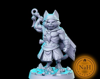 May include: A grey 3D printed miniature of a cat warrior holding a weapon and wearing a bandana. The cat has a fierce expression and is standing on a rocky base.