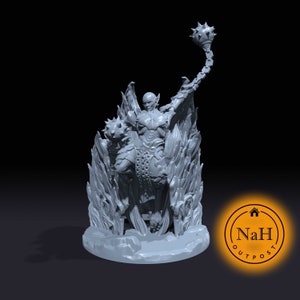May include: A gray, detailed miniature figurine of a demon riding a fiery beast, holding a spiked mace. The demon has wings and horns, and the beast has a long tail. The figurine is set on a round base with a textured surface.