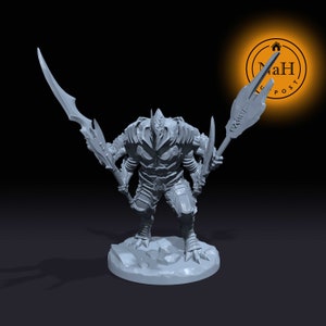 May include: A gray, detailed miniature figure of a creature with a spiky helmet, holding two weapons. The creature has a segmented body and appears to be wearing armor. The figure is standing on a round base.