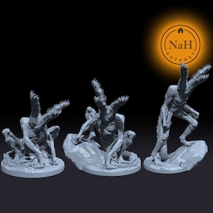 May include: Three gray 3D printed miniature figures of a creature with multiple limbs and a long tail. The creature has a humanoid torso and a head with sharp teeth. The figures are posed in different positions, with one standing, one sitting, and one crawling.