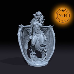May include: Gray 3D printed miniature of a female figure with snake-like hair, wearing a flowing robe and armor, with large wings and clawed feet.