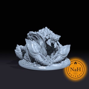 May include: A gray 3D printed miniature of a crab-like creature with multiple eyes and claws. The creature is sitting on a round base.