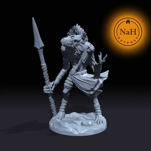 May include: A gray, detailed miniature figurine of a creature with a wolf-like head and a spear. The creature is standing on a round base.