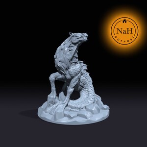 May include: A gray 3D printed miniature of a mythical creature with a horse head, a serpentine tail, and a scaly body. The creature is sitting on a rocky base.