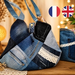 May include: A patchwork denim tote bag and matching wallet. The bag features various shades of blue denim, with a white lace trim and denim straps. The wallet has a floral trim and white lace. The bag is approximately 14 inches wide.