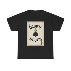 May include: Black t-shirt featuring a playing card design. The card reads "DROP'N A DEUCE" with a spade symbol. The number "2" appears on the top and bottom corners of the card. The design is in a vintage style.