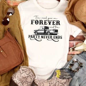 May include: White t-shirt with black text that reads "The road goes on FOREVER and the PARTY NEVER ENDS". A black and white illustration of a pickup truck is featured in the design.
