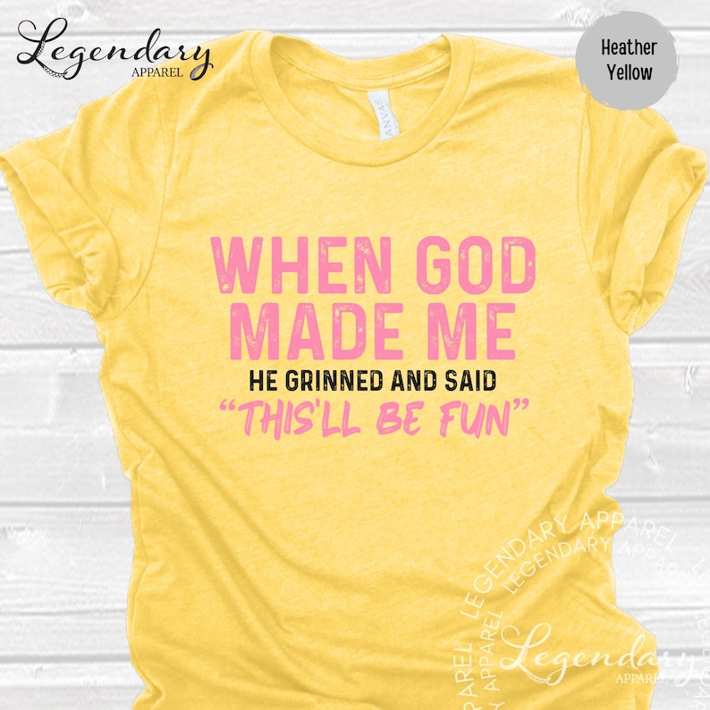 a yellow t-shirt with a humorous text printed on it.