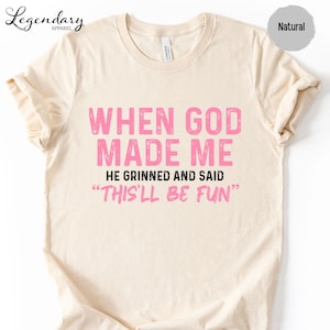 a light-colored t-shirt with a humorous text printed on it.
