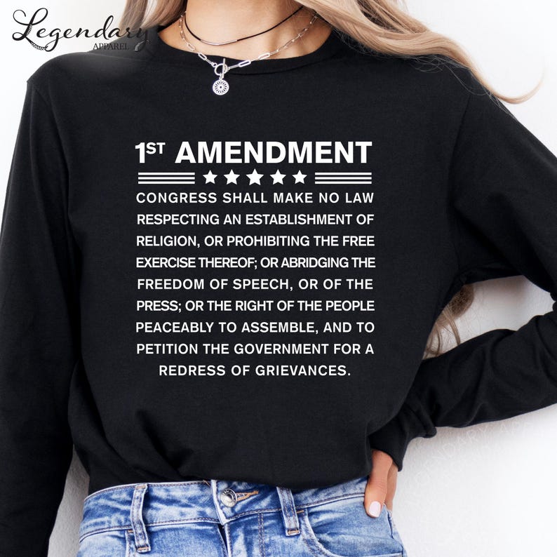 a black long-sleeved t-shirt with white text printed on it.