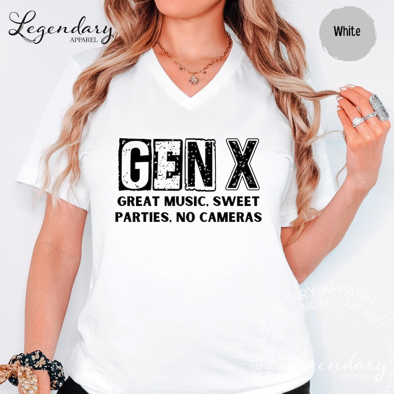 A woman wearing a white t-shirt with the text "GENX" printed on it, along with the text "GREAT MUSIC. SWEET PARTIES. NO CAMERAS" printed below.