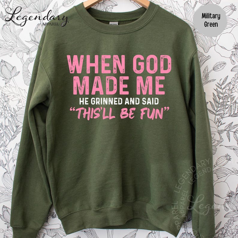 A green sweatshirt with a humorous text printed on it.