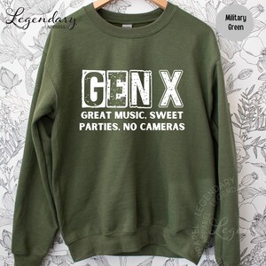 A green sweatshirt with white text printed on it.
