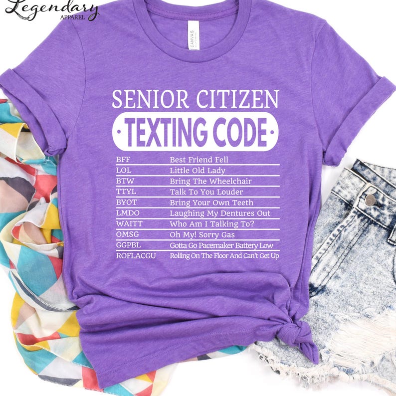A purple t-shirt with a list of humorous texting codes printed on it, along with a denim skirt and a colorful scarf.