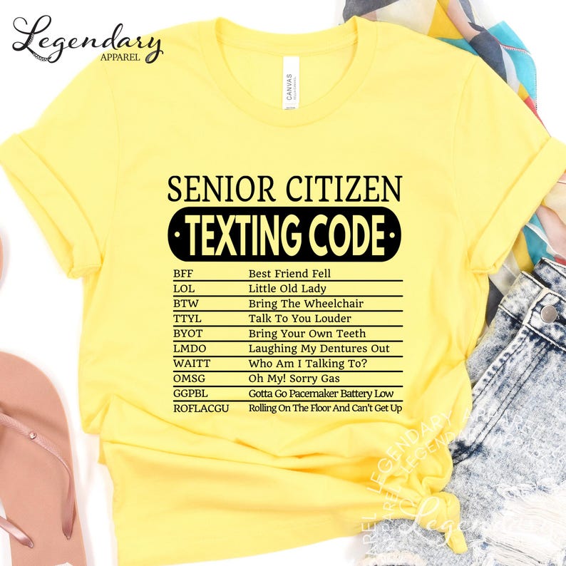 a yellow t-shirt with a list of various texts and phrases, including "Best Friend Fell", "Little Old Lady", "Bring The Wheelchair", "Talk To You", "Bring Your Own Teeth", "Laughing My Dentures Out", "Who Am I Talking To?", "Gonna Go Pecemaker Battery Low", and "Rolling On The Floor And Can't Get Up".