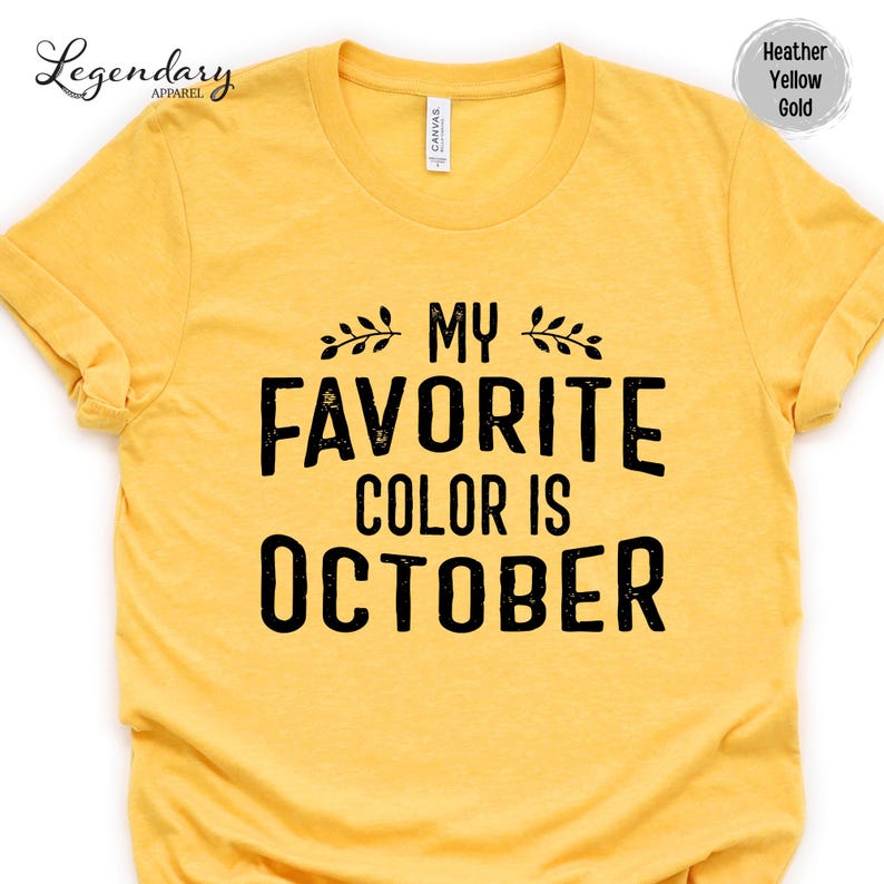 A yellow t-shirt with the text "My Favorite Color Is October" printed on it.