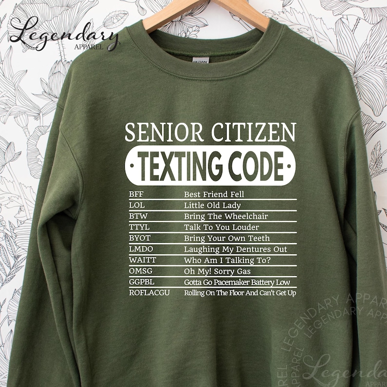 A green sweatshirt with a list of humorous texting rules printed on it.