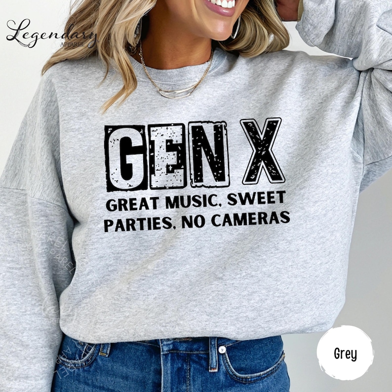 A woman wearing a grey sweatshirt with the text "GENX" printed on it.