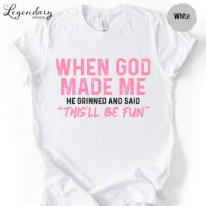A white t-shirt with a humorous text printed on it.