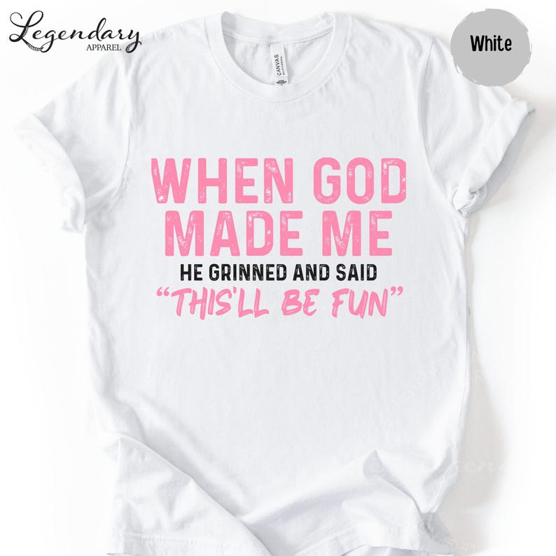 A white t-shirt with a humorous text printed on it.