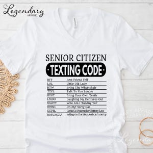A white t-shirt with a humorous text printed on it, which appears to be a list of rules or guidelines for senior citizens and citizens.