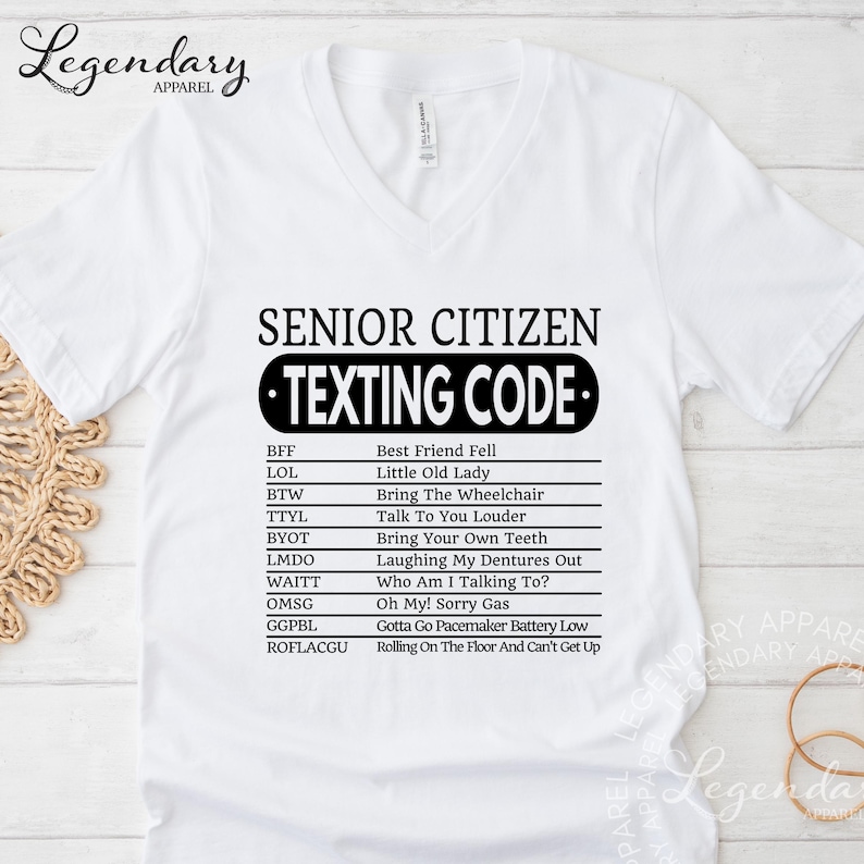A white t-shirt with a humorous text printed on it, which appears to be a list of rules or guidelines for senior citizens and citizens.