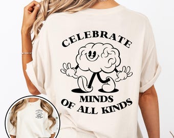 May include: A white t-shirt with a black graphic of a cartoon brain walking and the text "Celebrate Minds of All Kinds".