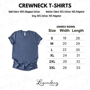 May include: A blue crewneck t-shirt with rolled-up sleeves is displayed. The image includes text detailing the shirt's composition: 100% ringspun cotton for solid colors, and a blend for heather colors. A size chart is also present.