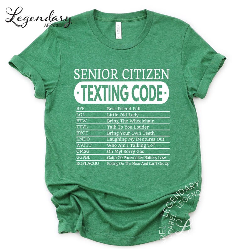 The image is a green t-shirt with white text that reads "SENIOR CITIZEN TEXTING CODE" printed on it.