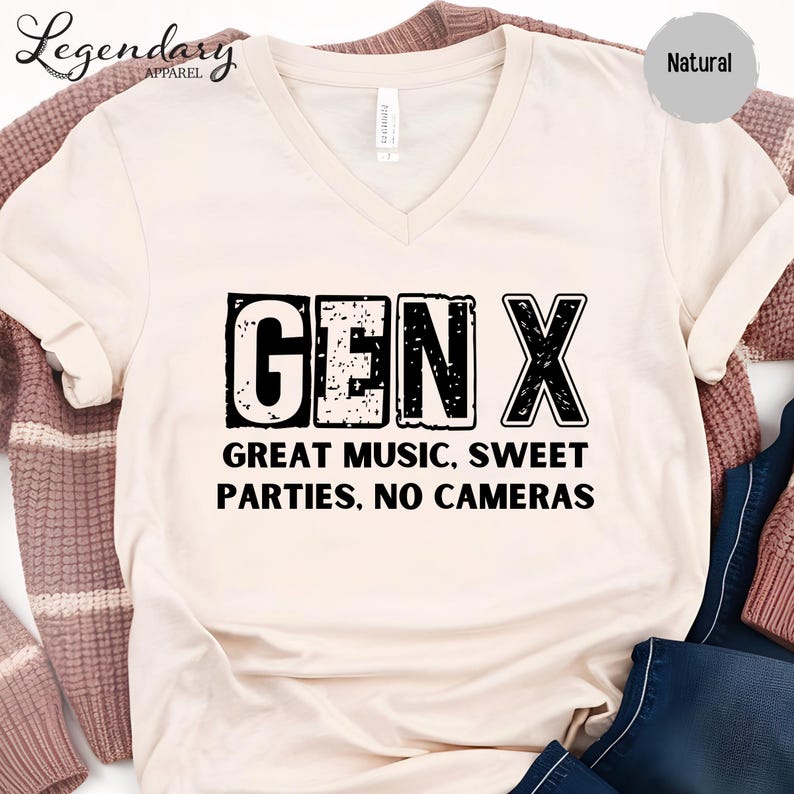 a white t-shirt with a black text design that reads "GENX" and below it "GREAT MUSIC, SWEET PARTIES. NO CAMERAS".