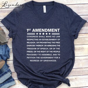 A navy blue t-shirt with white text printed on it, which appears to be a reference to the First Amendment of the United States Constitution.