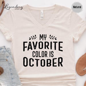 a white t-shirt with the text "My Favorite Color Is October" printed on it.