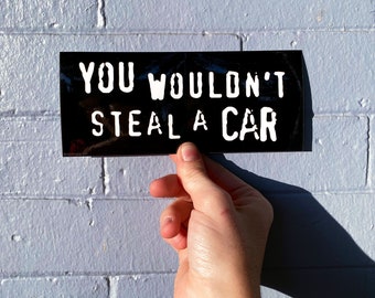 You Wouldn't Steal A Car • High Quality Weatherproof Vinyl Bumper Sticker • 10in x 3in • Piracy Commercial