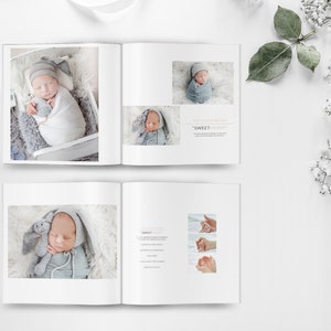 May include: A photo album with a white cover and a white background. The album is open to a page with a photo of a baby in a white and gray swaddle. The baby is holding a stuffed animal. The next page has a photo of the baby in a gray and white swaddle. The page also has the text "The lovely arrival "SWEETHEART"".
