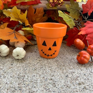 2.75” Hand-painted flower pot- happy pumpkin planter