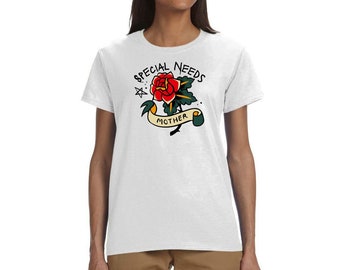 May include: White t-shirt featuring a traditional tattoo-style design. The design includes a red rose, green leaves, and the words "SPECIAL NEEDS MOTHER" in black lettering. The shirt is a classic crew neck style.