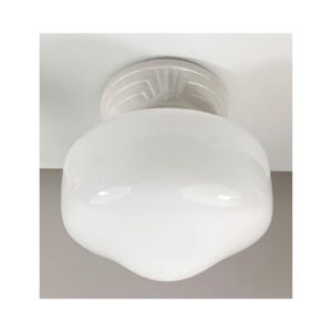 May include: A white, vintage-style ceiling light fixture with a rounded, opaque glass shade. The fixture has a decorative, circular base. The light is designed to be mounted on a ceiling.