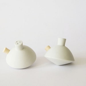 Porcelain salt shaker spinning top with 3 holes