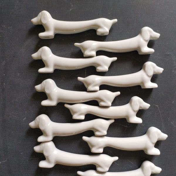 Dachshund knife rests, set of 10 white porcelain dogs, mid century French table decor