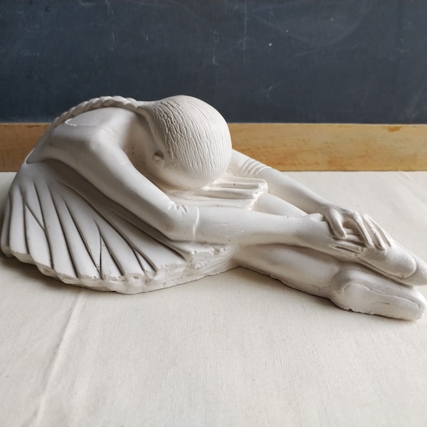 Vintage ballerina statue, young French ballet dancer stretching, plaster sculpture