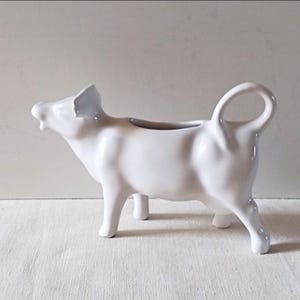 Vintage cow creamer, French porcelain milk dispenser
