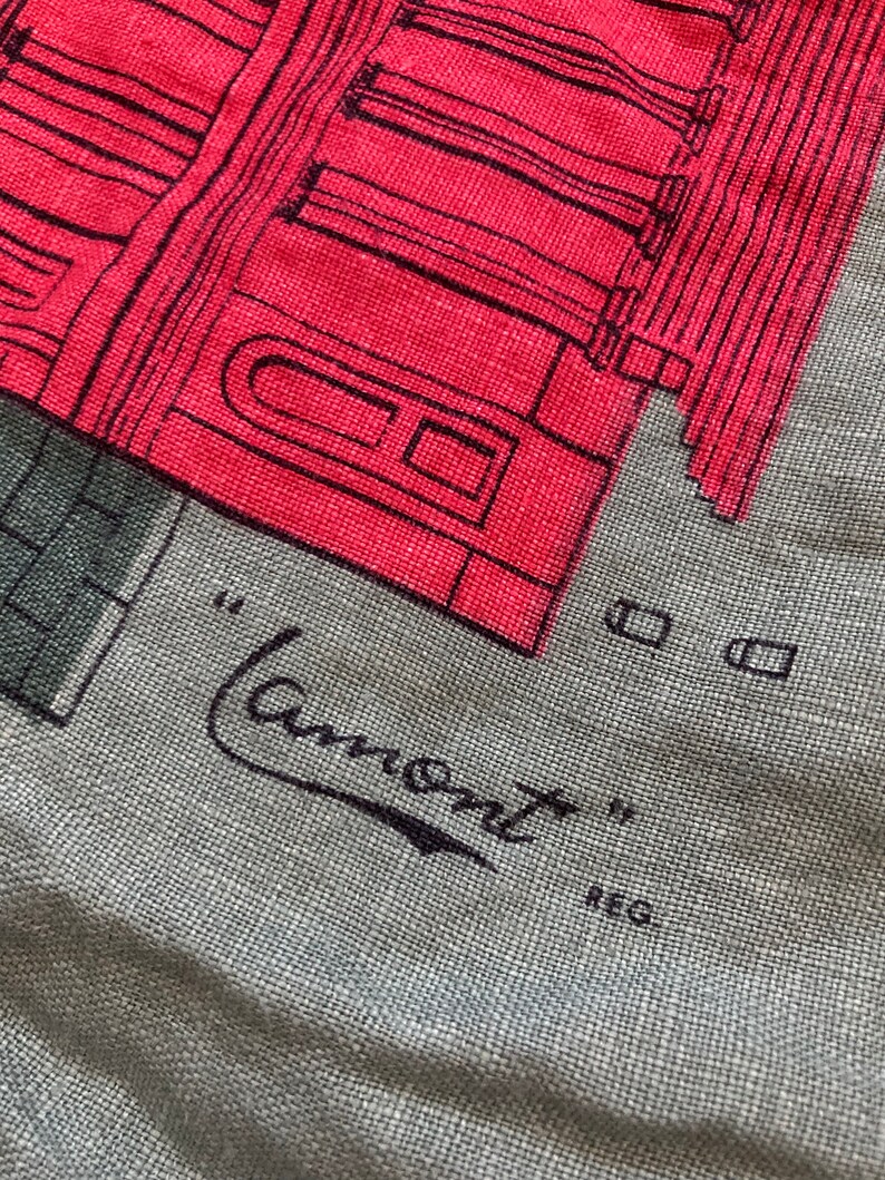 May include: A gray fabric tote bag with a red and black illustration of a building. The text "Lamont" is written in black cursive with the word "REG" below it.