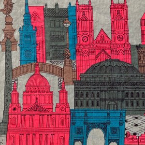 May include: A vintage linen tea towel featuring a colorful illustration of London landmarks, including Big Ben, St. Paul's Cathedral, and the Tower Bridge. The design is in shades of red, blue, and green.