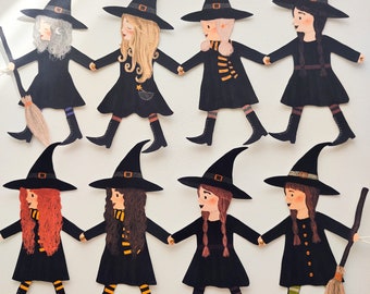 May include: Ten black witch figures with pointed hats, each with a different hairstyle and facial expression. The figures are all wearing black dresses and have white accents on their hats and dresses.