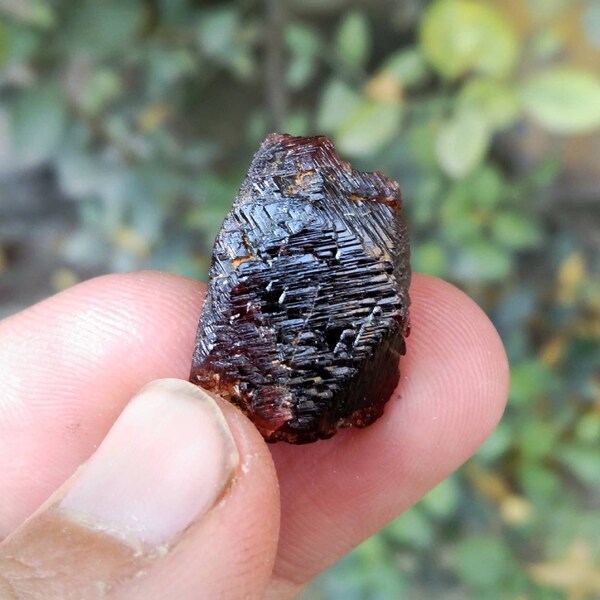 Etched red Spessertine garnet crystal with interesting formation from Skardu Pakistan.