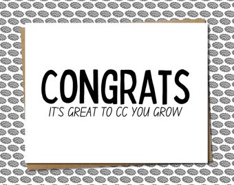 May include: A white greeting card with the word "CONGRATS" in bold black letters. Below, the text reads "IT'S GREAT TO CC YOU GROW". The card has a brown border and is set against a gray patterned background.